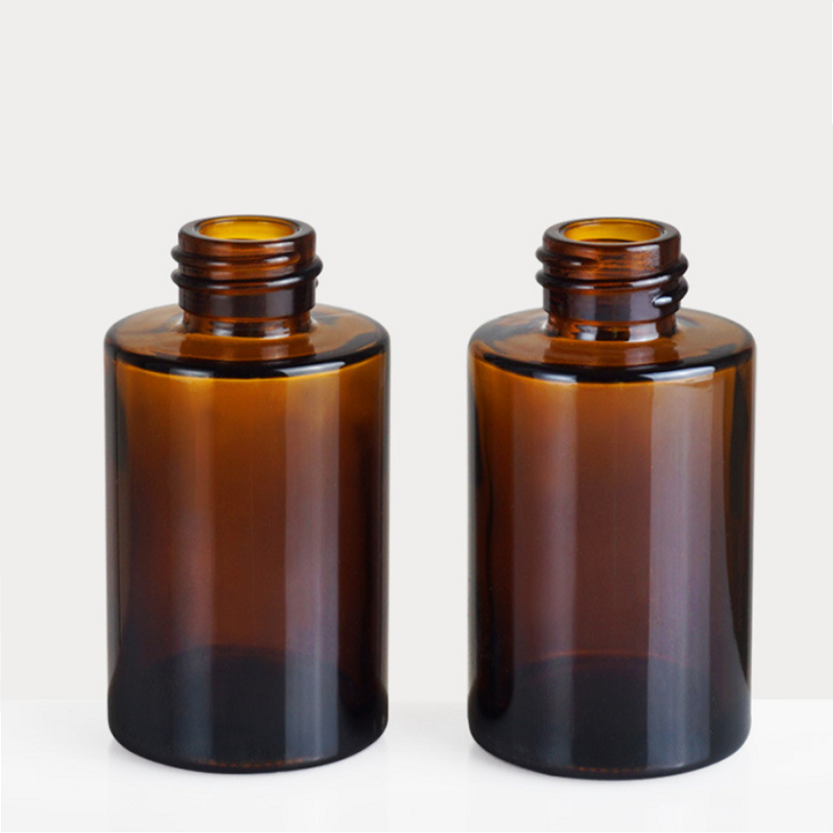 flat shoulder essential oil glass bottle